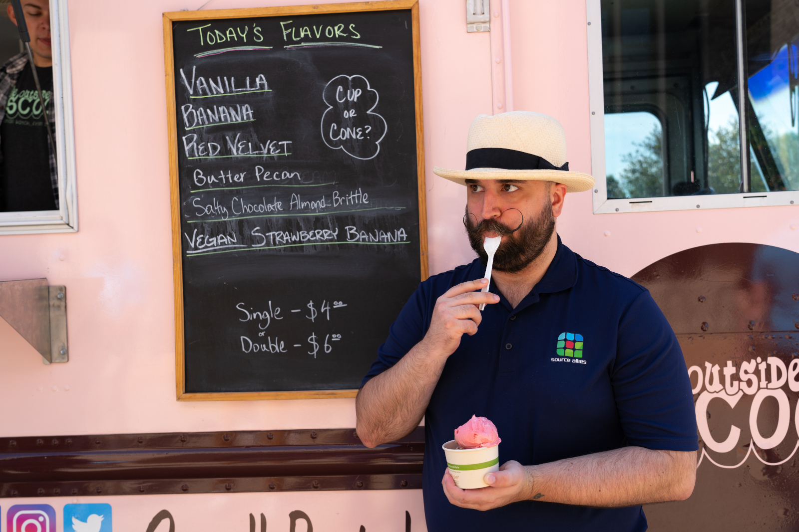 Source Allies teammate enjoying ice cream at a company event
