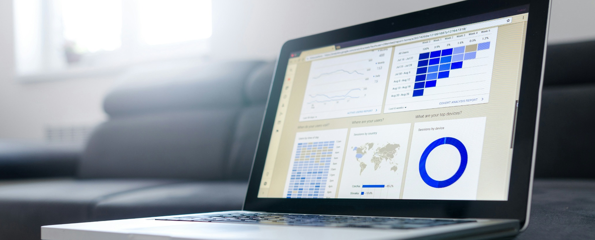 Laptop displaying data analytics charts.